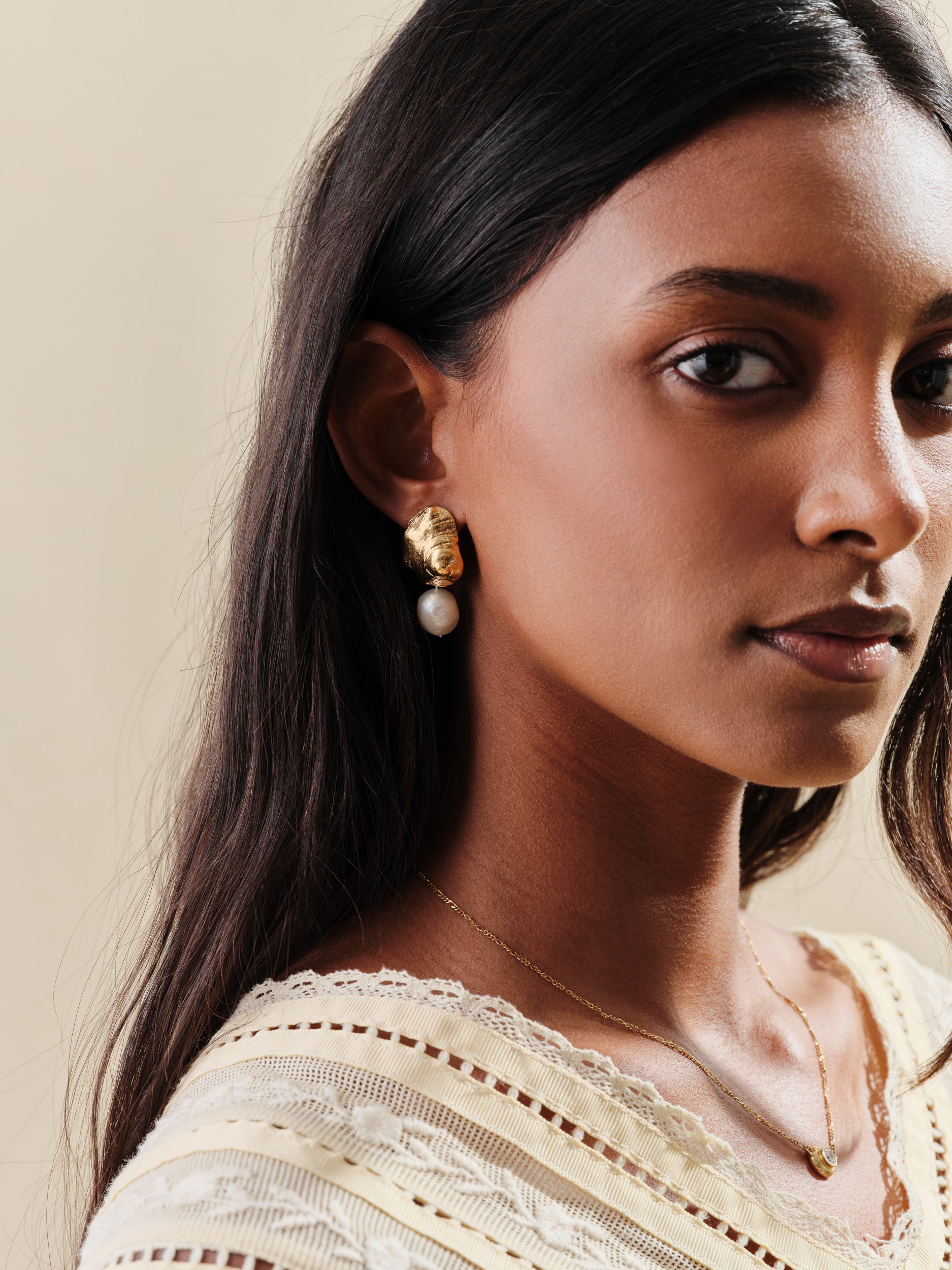 Gold shell earrings with hanging freshwater pearls