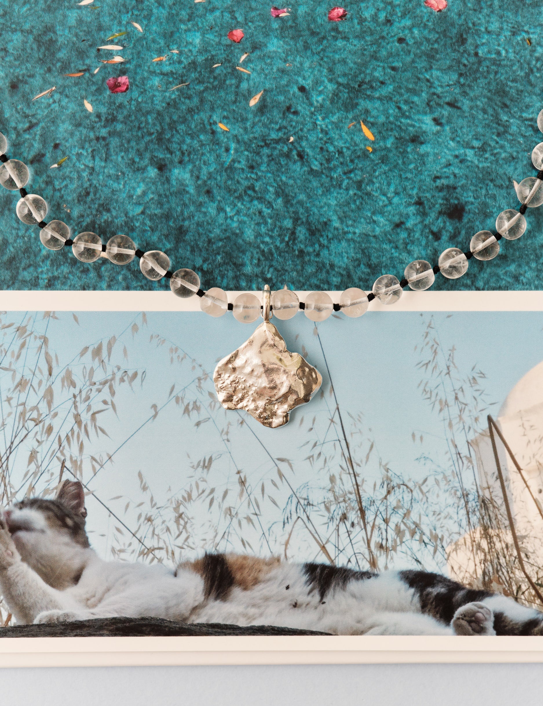 Transparent bead and silver shell pendant 