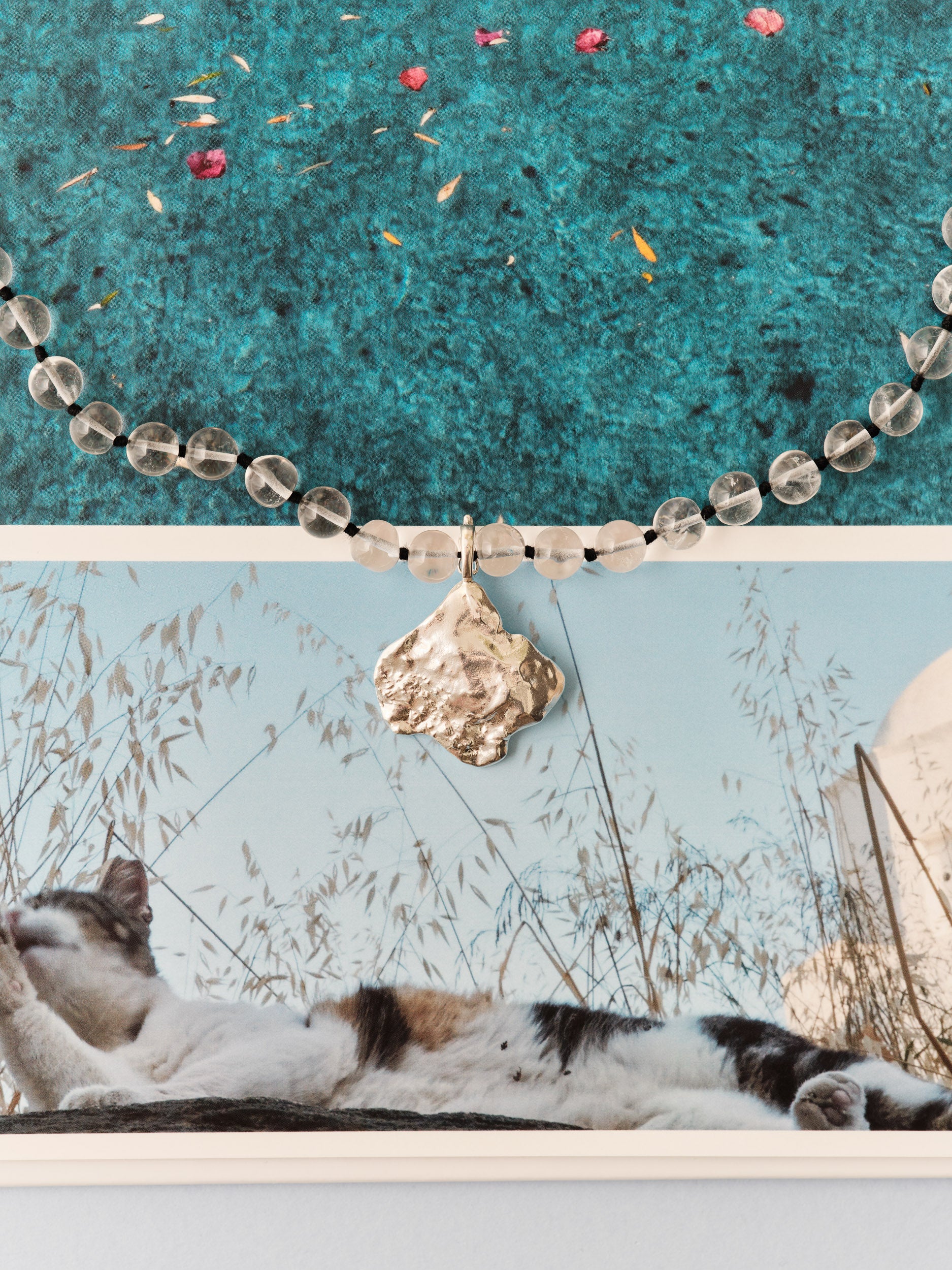 Transparent bead and silver shell pendant 