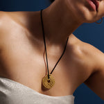 large-gold-pendant-on-cord