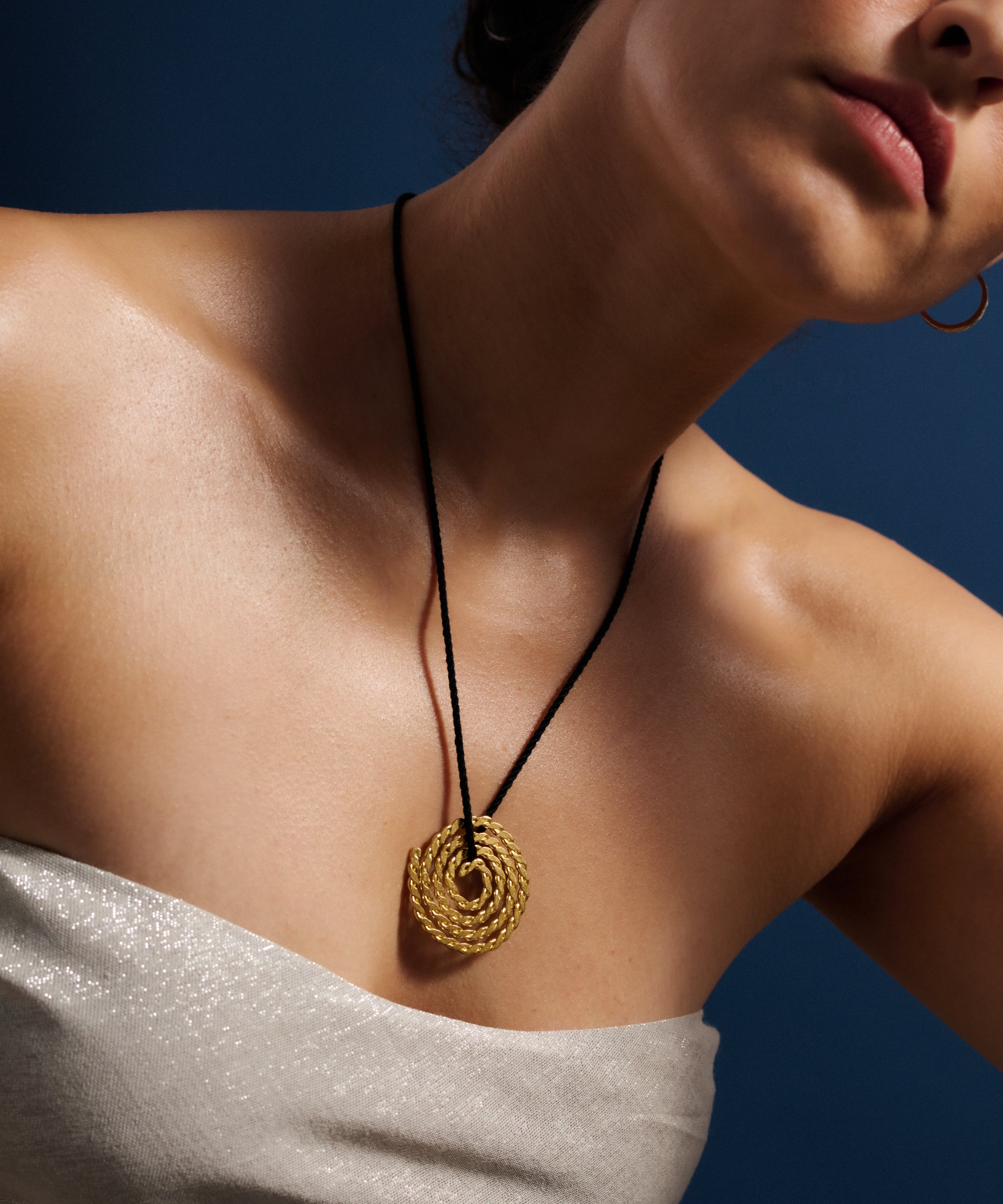 large-gold-pendant-on-cord