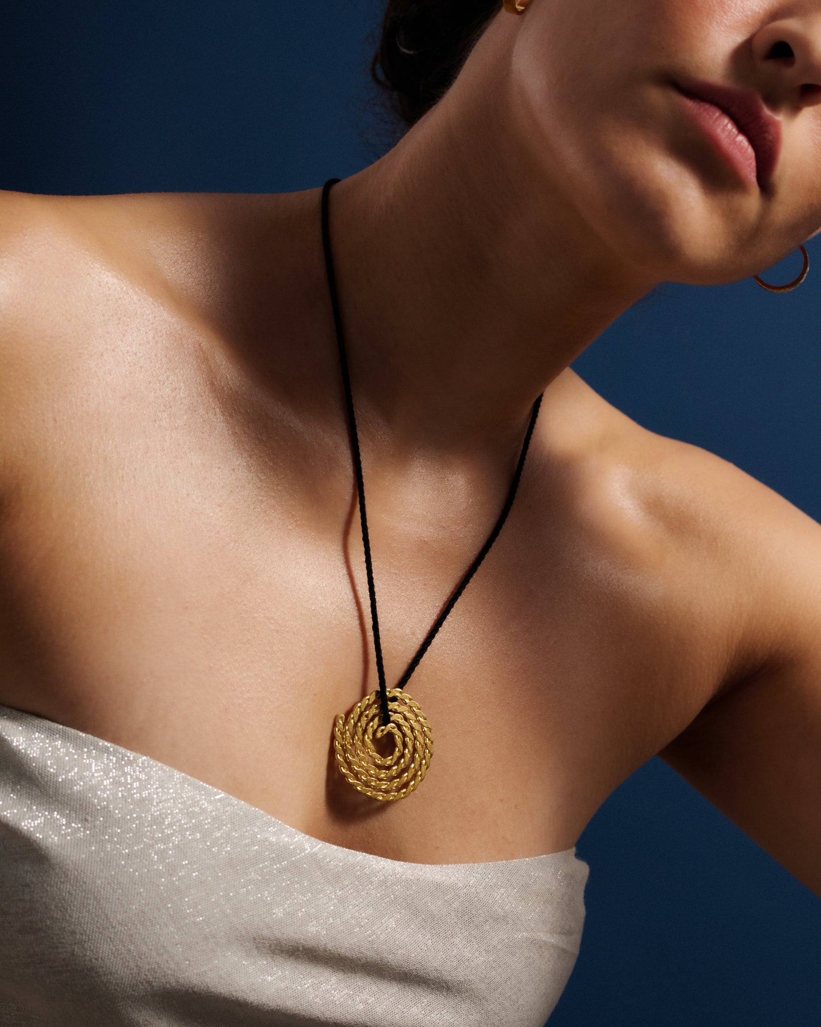 large-gold-pendant-on-cord