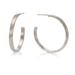 Sterling silver hammered hoops by Kitty Joyas